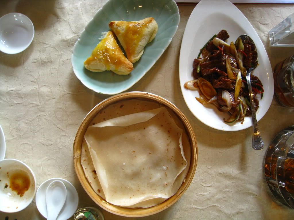 Barbecue pork puffs and stir-fried sliced beef with scallions served with pancakes