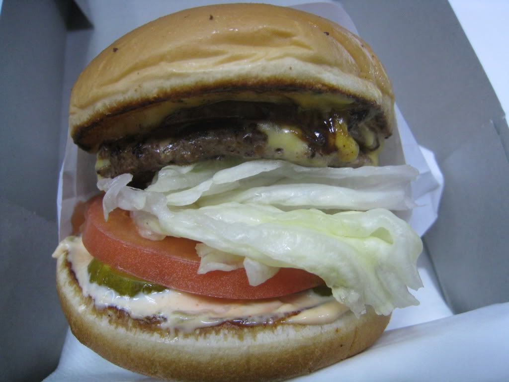 Cheeseburger with whole grilled onions