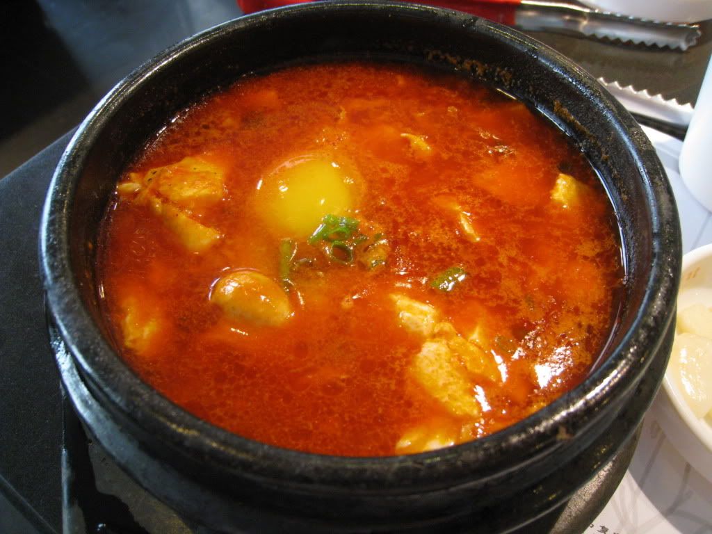 Spicy tofu with egg in hot stone pot